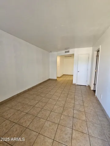 a view of an empty room and window