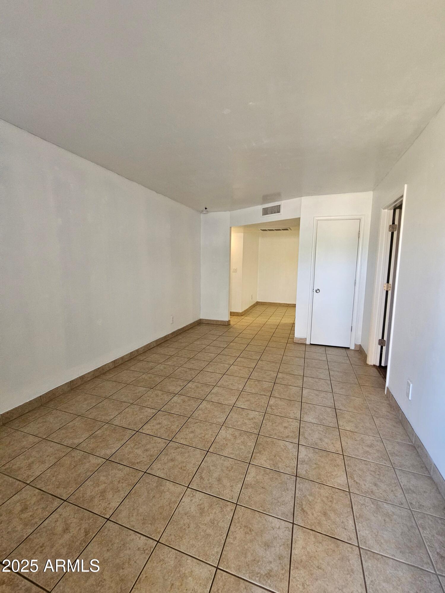 180 North Apache Road, Unit 24 Buckeye, AZ 85326 - Photo 15 of 32 a view of an empty room and window
