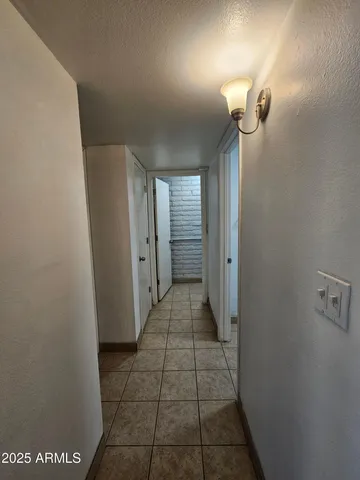 a view of a bathroom from a hallway