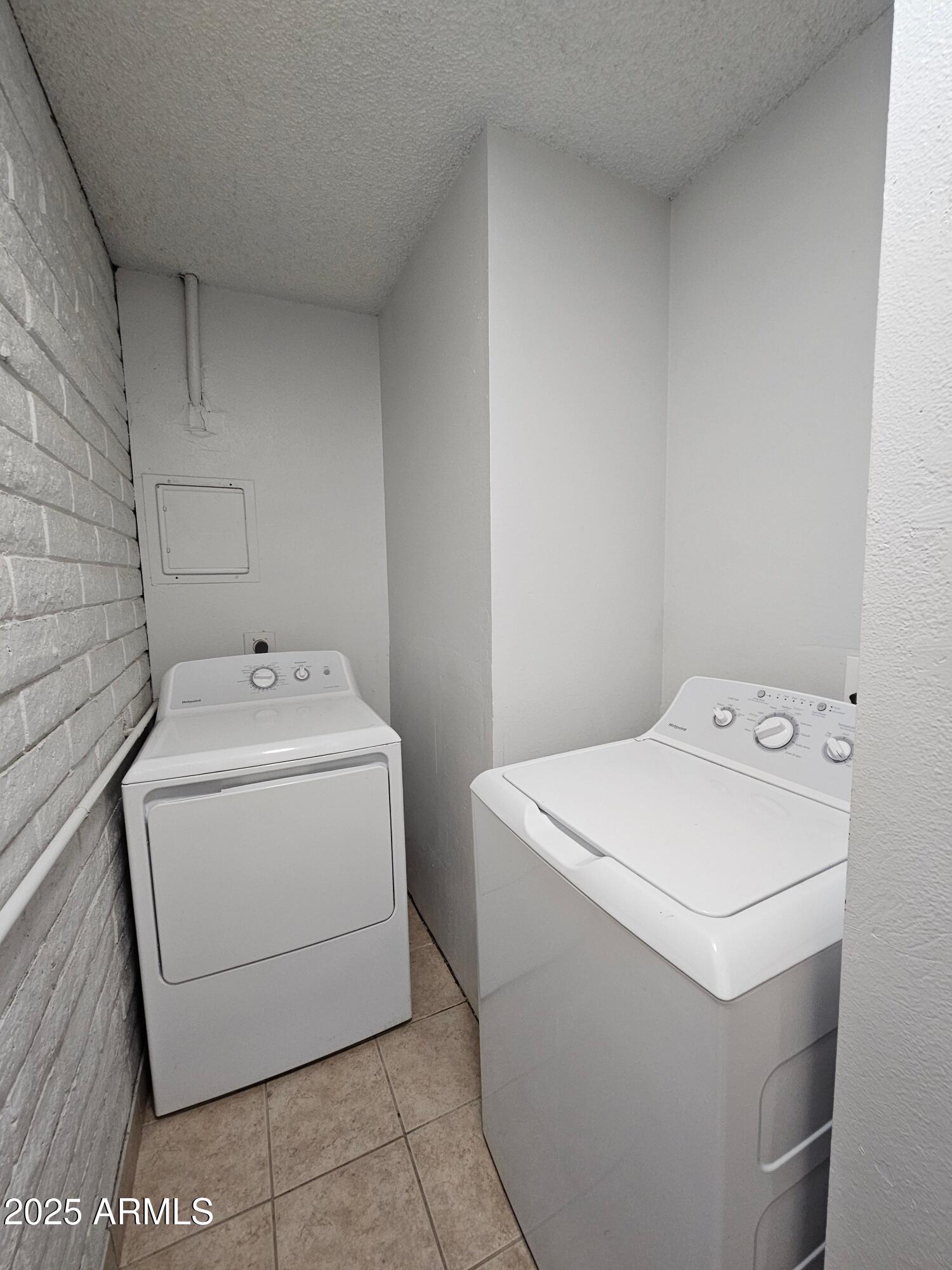 180 North Apache Road, Unit 24 Buckeye, AZ 85326 - Photo 24 of 32 a utility room with dryer and washer