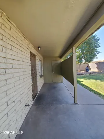 a view of an empty room with a balcony