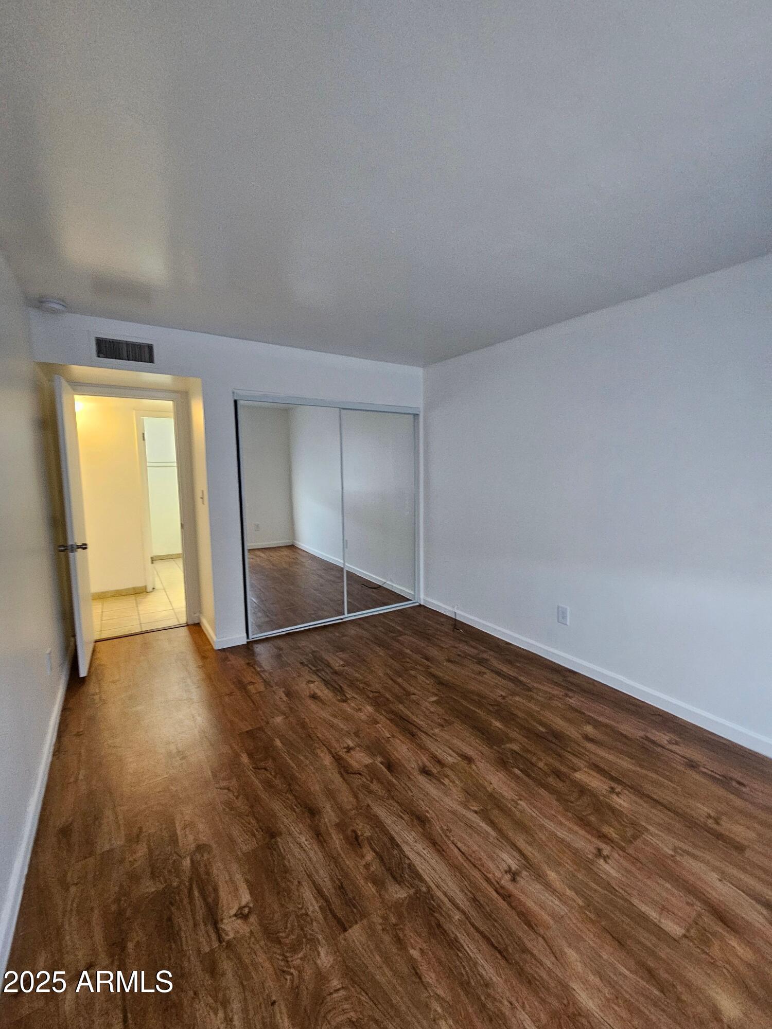 180 North Apache Road, Unit 24 Buckeye, AZ 85326 - Photo 6 of 32 a view of an empty room and window