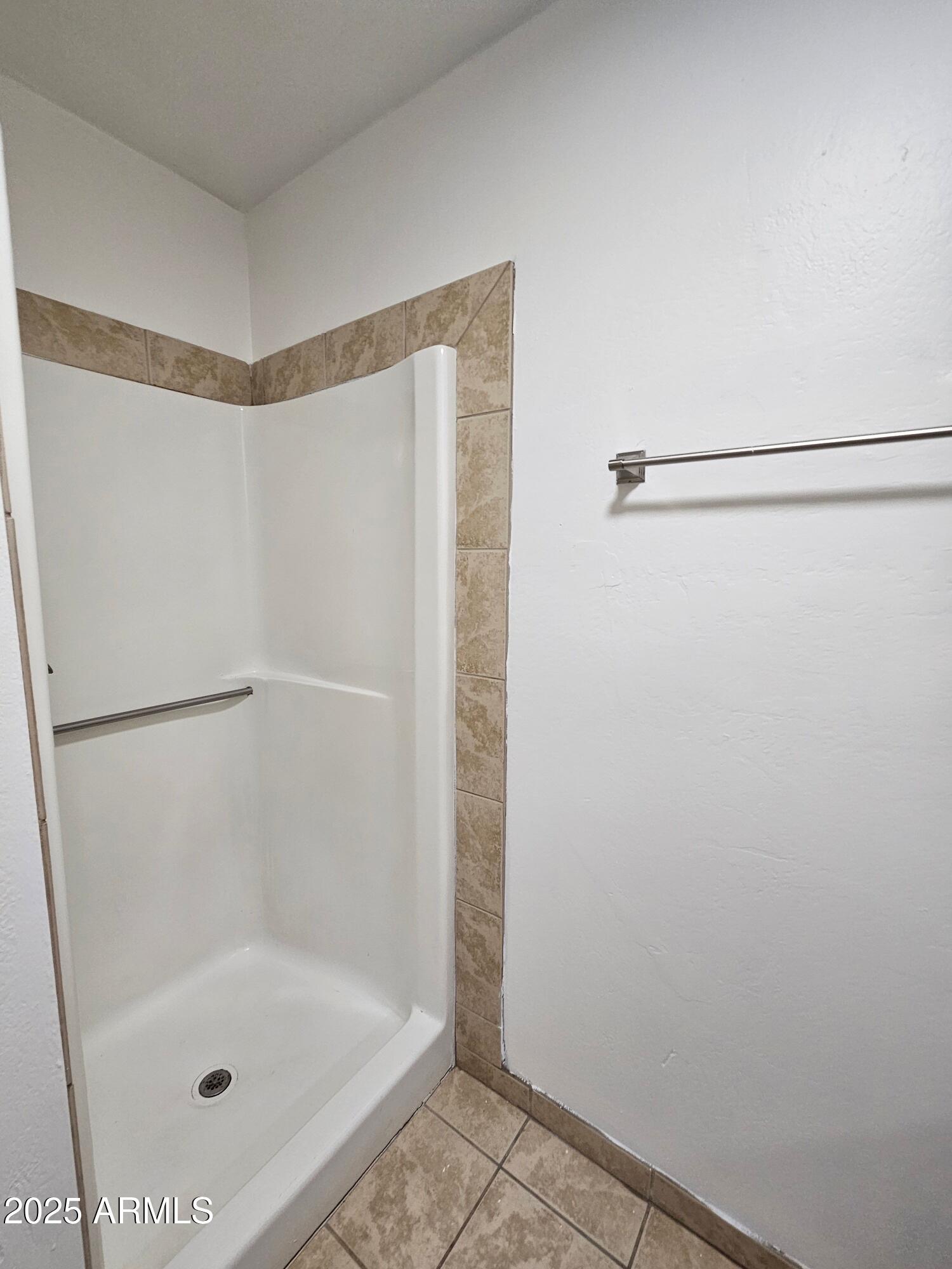 180 North Apache Road, Unit 24 Buckeye, AZ 85326 - Photo 9 of 32 a bathroom with a shower