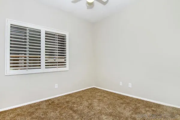 a view of empty room with windows