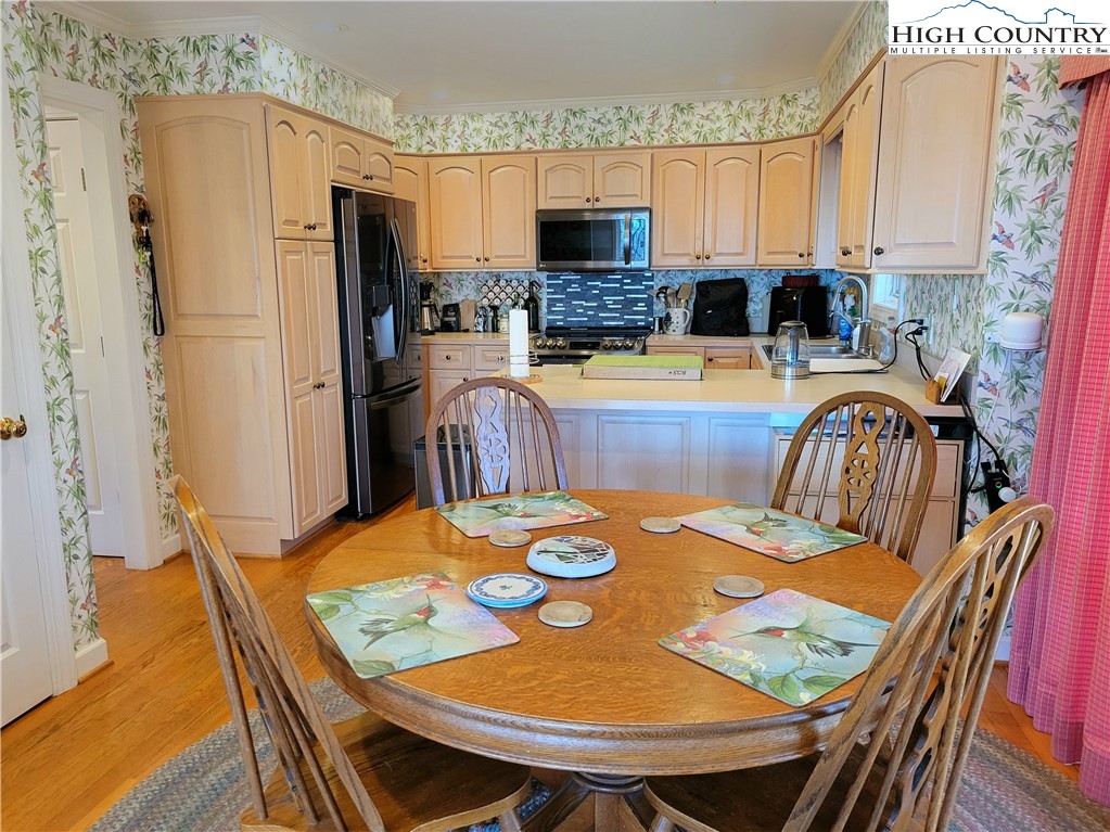 272 Maple Ridge Drive Boone, NC 28607 - Photo 11 of 41 a view of a dining room with furniture