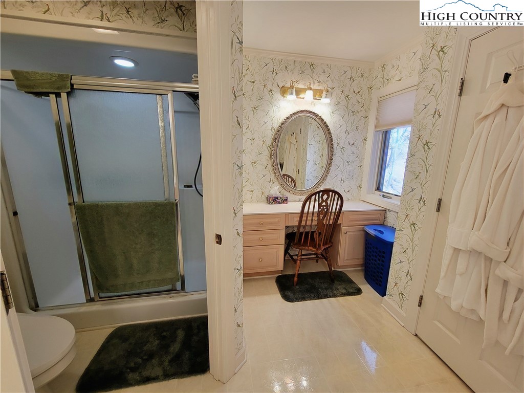 272 Maple Ridge Drive Boone, NC 28607 - Photo 21 of 41 a bathroom with a sink and a mirror