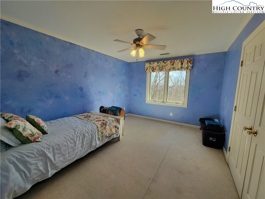 272 Maple Ridge Drive Boone, NC 28607 - Photo 22 of 41 a bedroom with bed and window