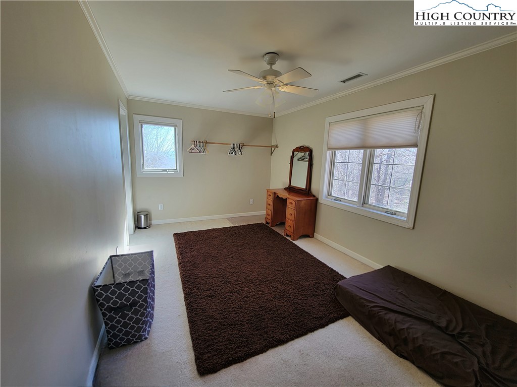 272 Maple Ridge Drive Boone, NC 28607 - Photo 25 of 41 a bedroom with a bed and a dresser