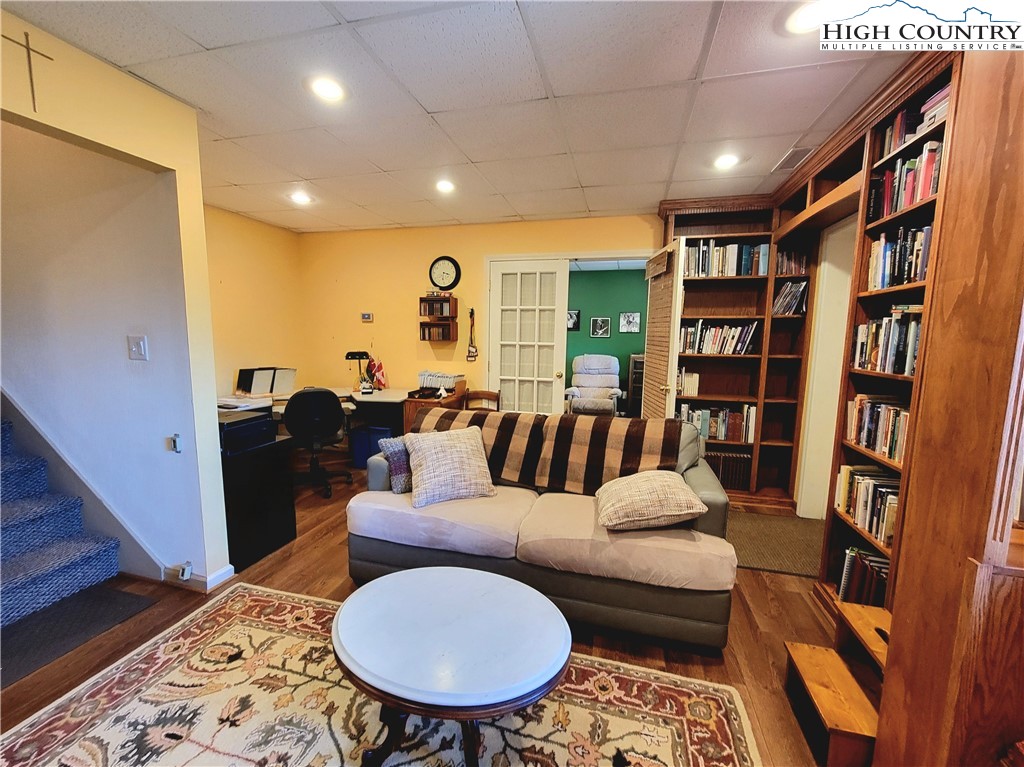 272 Maple Ridge Drive Boone, NC 28607 - Photo 29 of 41 a living room with furniture and a book shelf