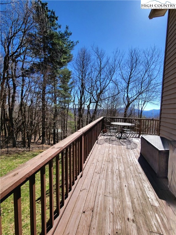 272 Maple Ridge Drive Boone, NC 28607 - Photo 36 of 41 a view of balcony with wooden floor and fence