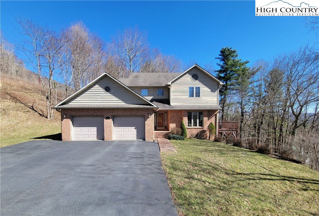 272 Maple Ridge Drive Boone, NC 28607 - Photo 41 of 41 a view of a house with a yard