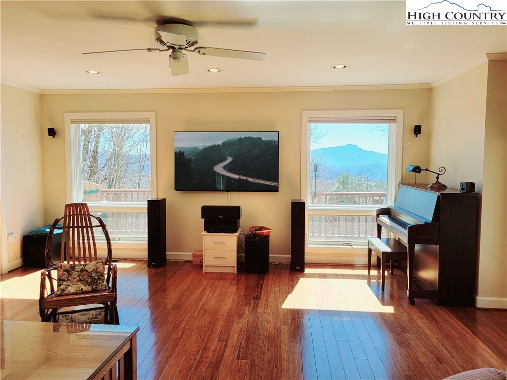 272 Maple Ridge Drive Boone, NC 28607 - Photo 6 of 41 a living room with furniture and a flat screen tv