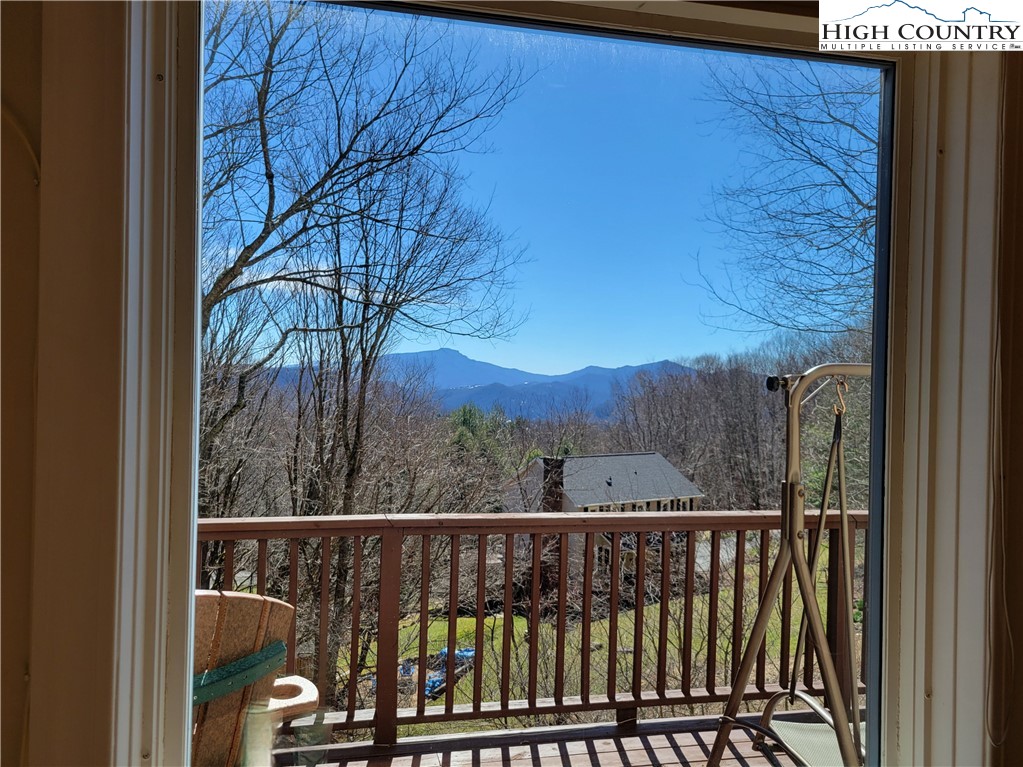 272 Maple Ridge Drive Boone, NC 28607 - Photo 8 of 41 a view of a balcony with wooden fence and floor