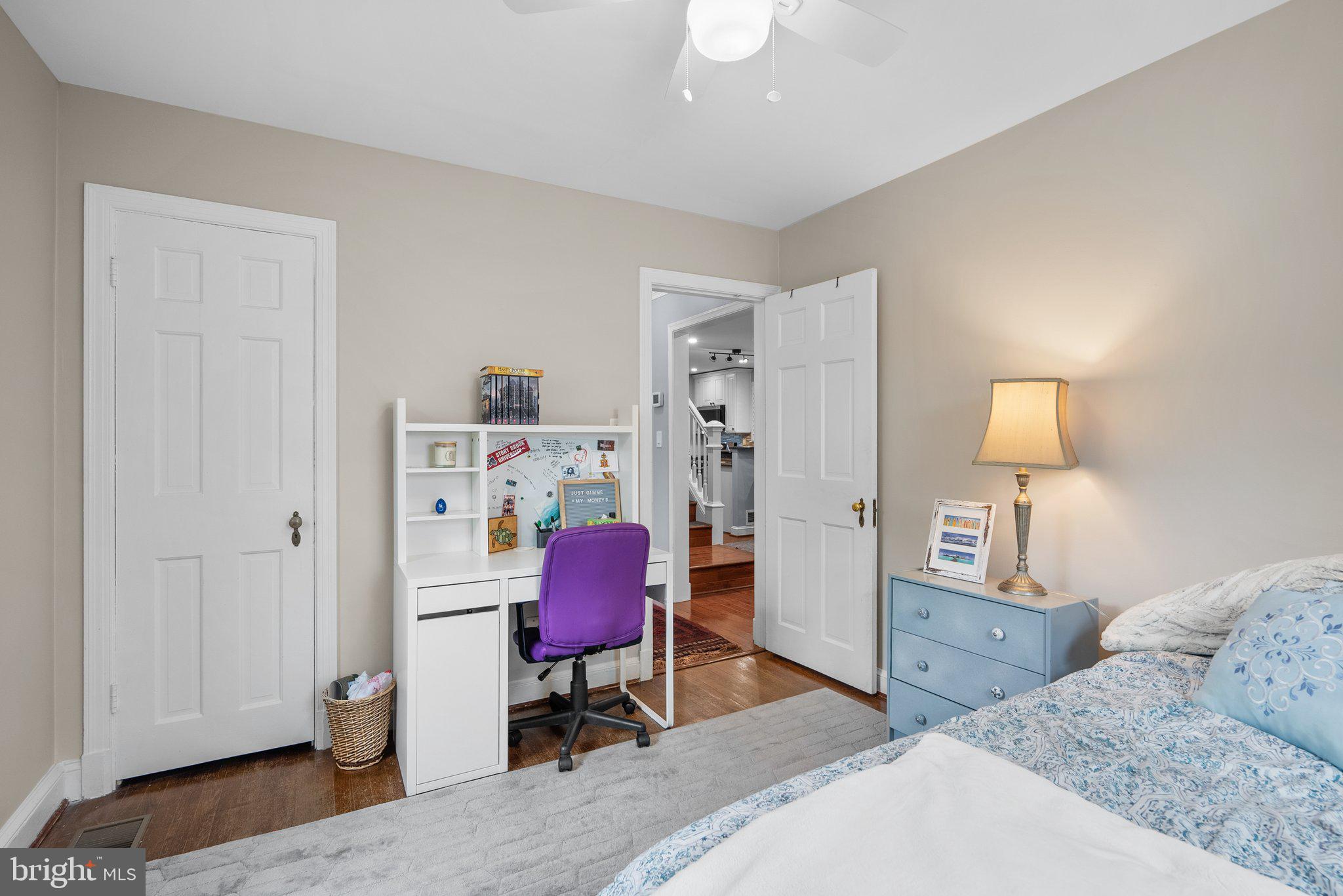 9911 Edgehill Lane Silver Spring, MD 20901 - Photo 13 of 45 a bedroom with a bed and a workspace