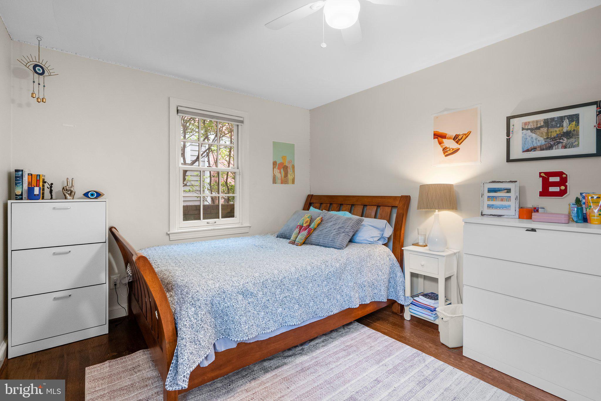 9911 Edgehill Lane Silver Spring, MD 20901 - Photo 16 of 45 a bedroom with a bed and a table in it