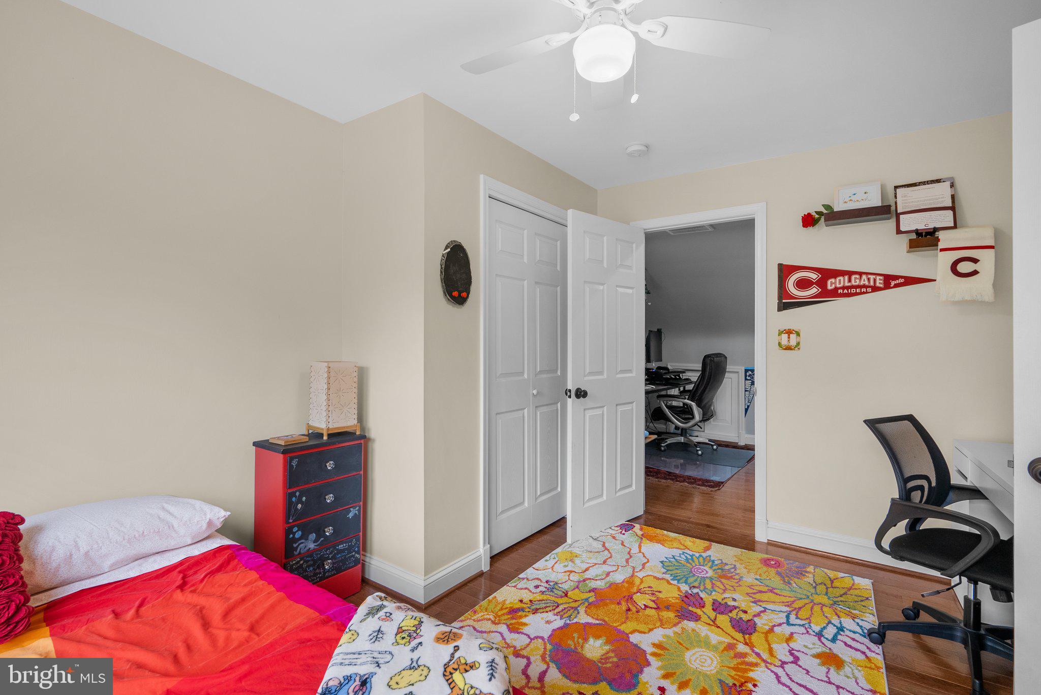 9911 Edgehill Lane Silver Spring, MD 20901 - Photo 20 of 45 a bedroom with bed and a chandelier