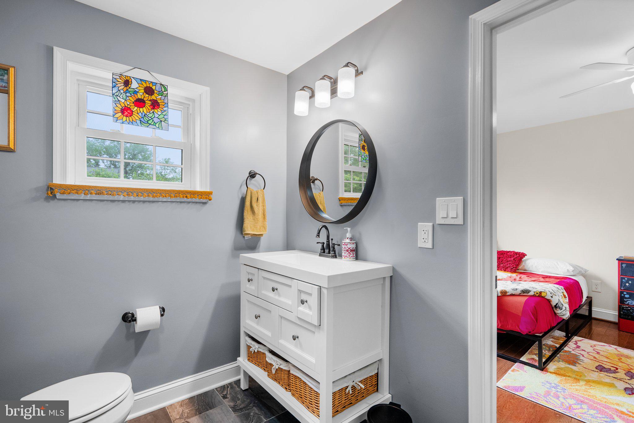 9911 Edgehill Lane Silver Spring, MD 20901 - Photo 21 of 45 a living room with furniture and a mirror
