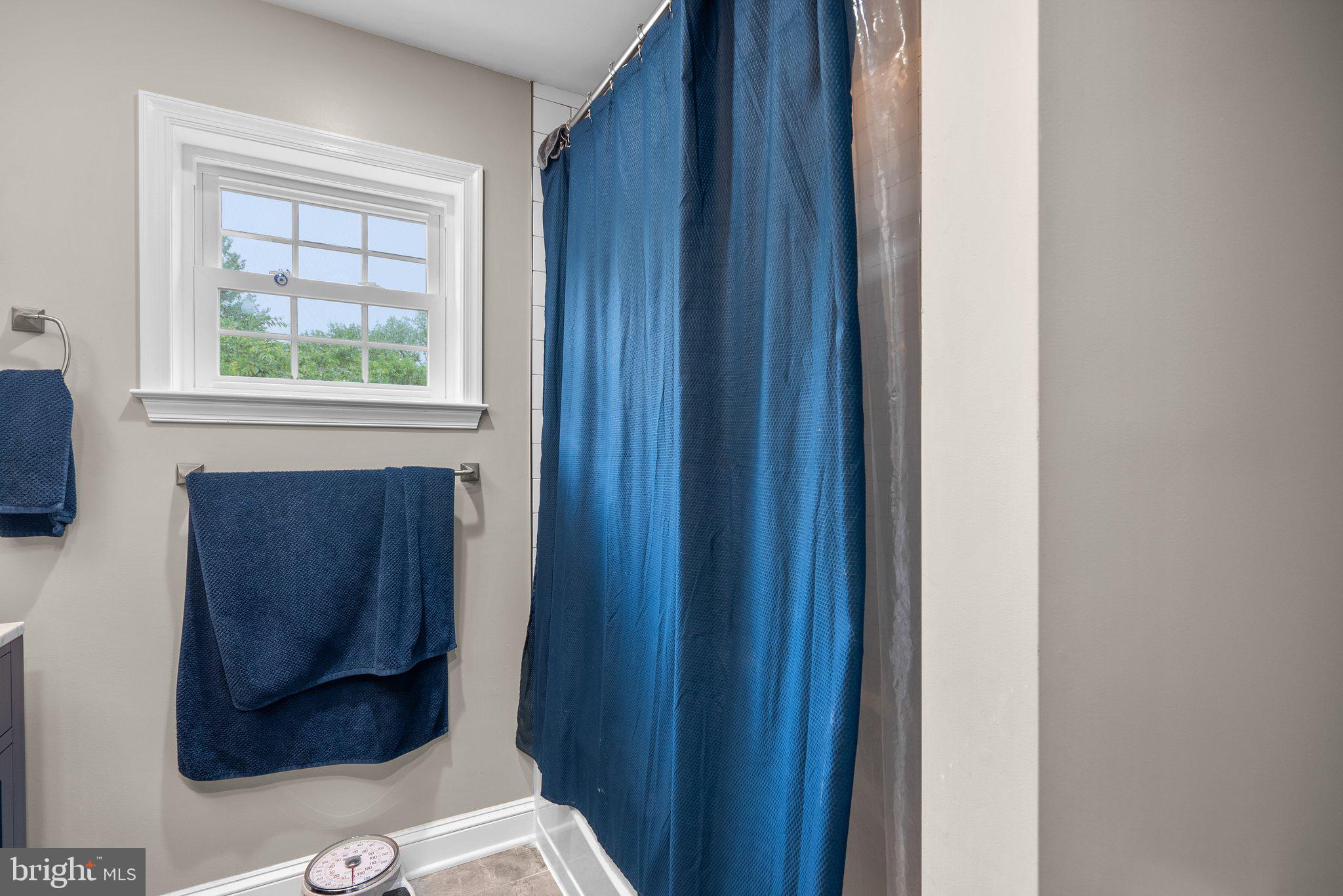 9911 Edgehill Lane Silver Spring, MD 20901 - Photo 26 of 45 a bathroom with a window and a window