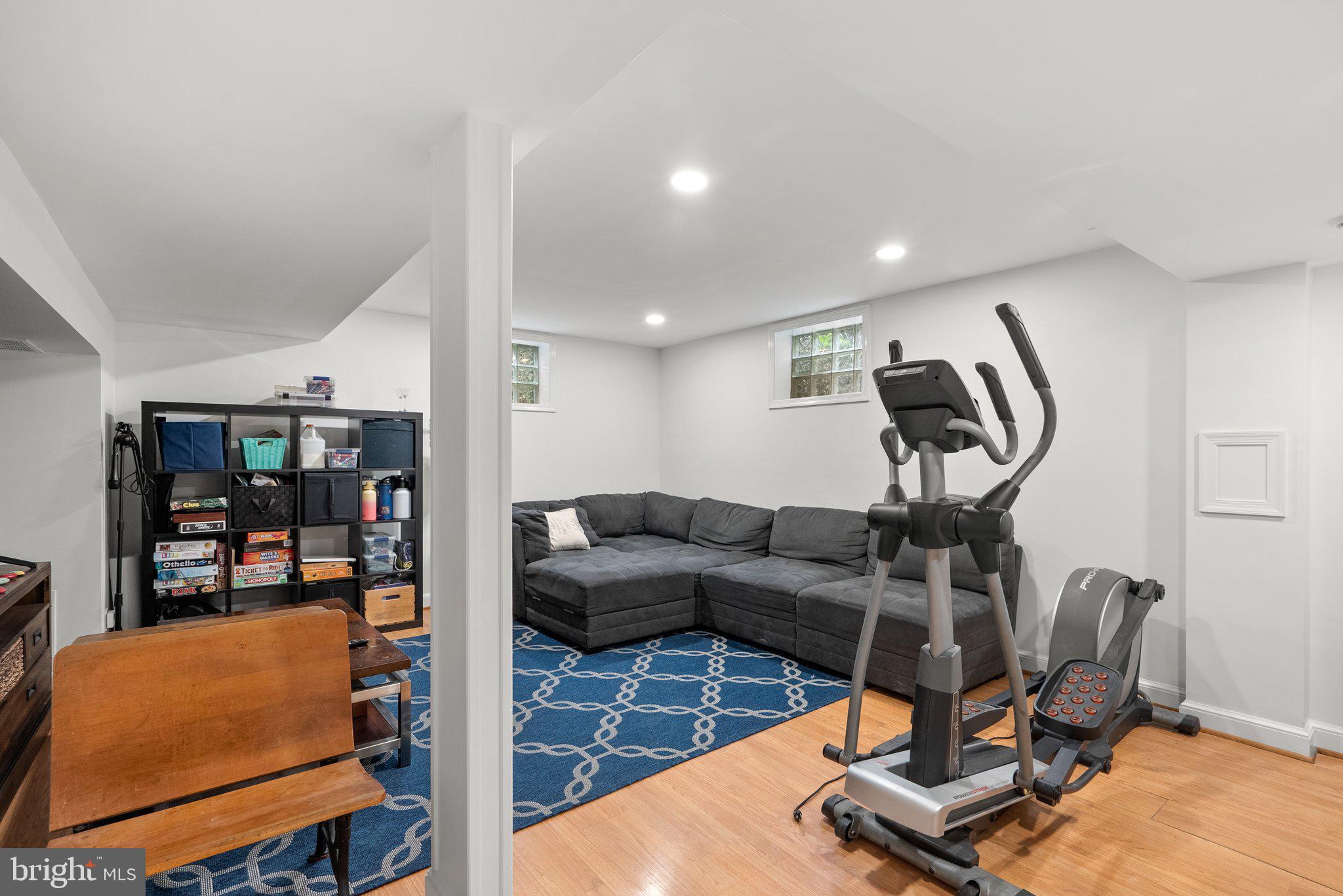 9911 Edgehill Lane Silver Spring, MD 20901 - Photo 27 of 45 a living room with furniture and a flat screen tv