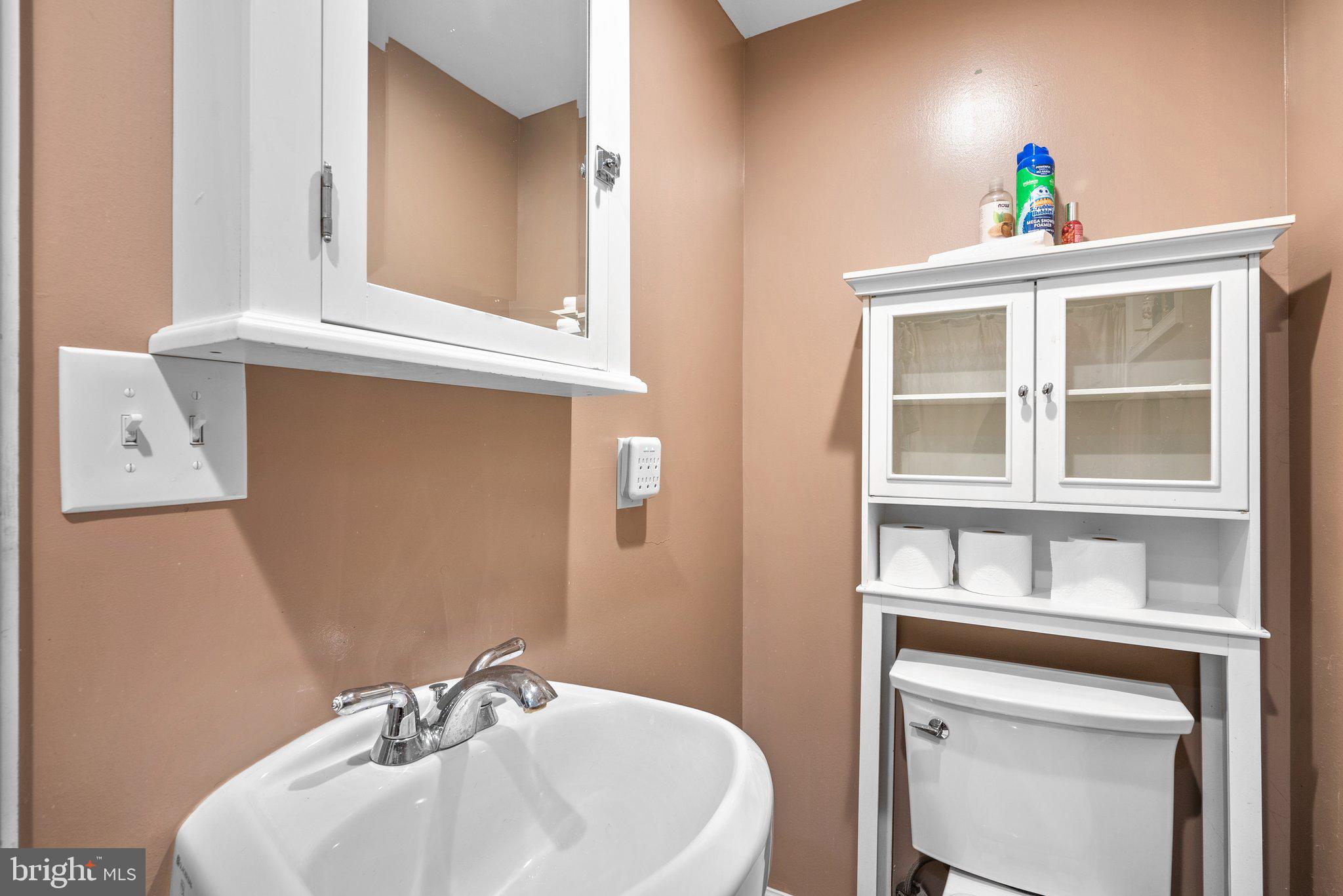 9911 Edgehill Lane Silver Spring, MD 20901 - Photo 30 of 45 a bathroom with a sink and a mirror