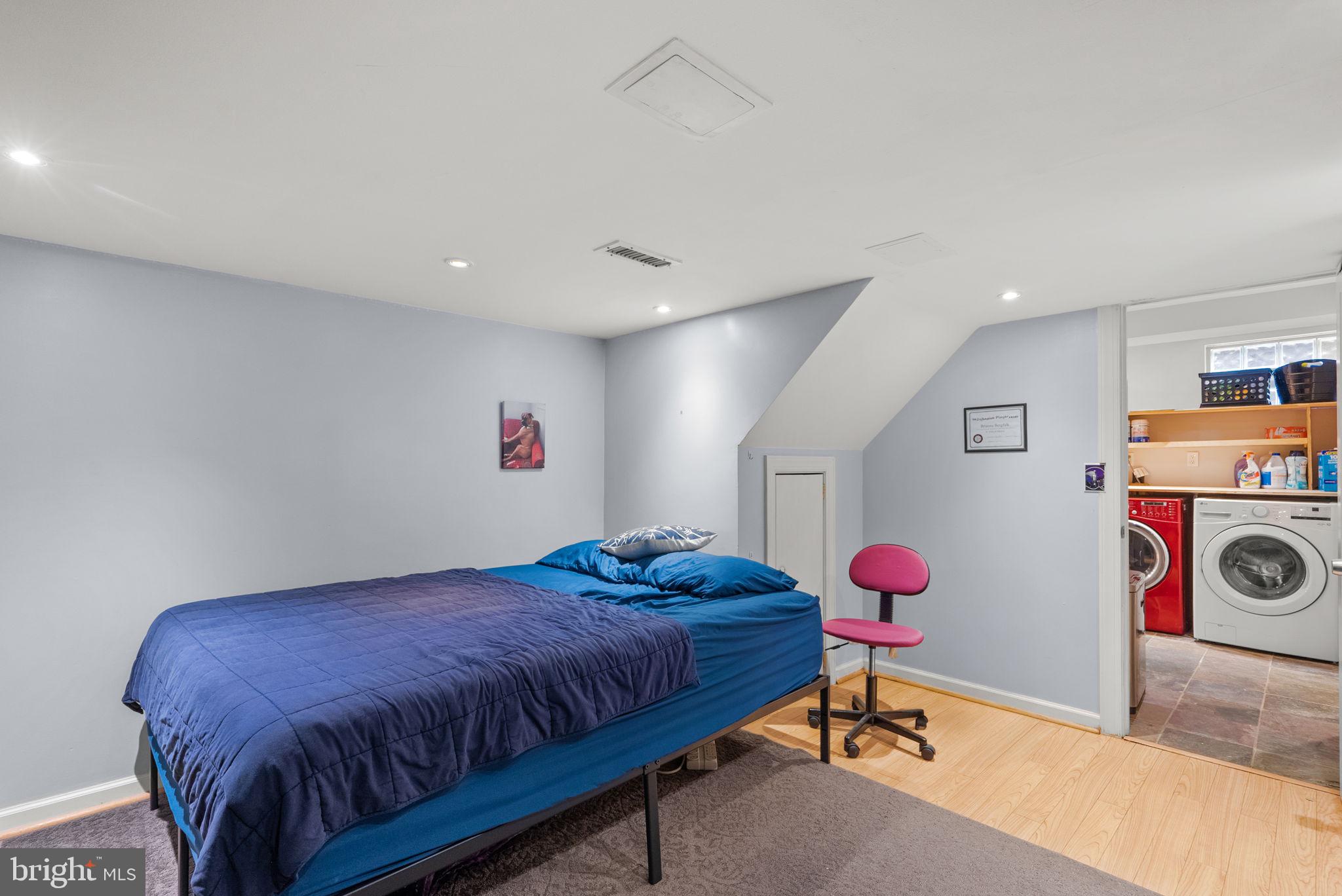 9911 Edgehill Lane Silver Spring, MD 20901 - Photo 32 of 45 a bedroom with a bed and cabinets