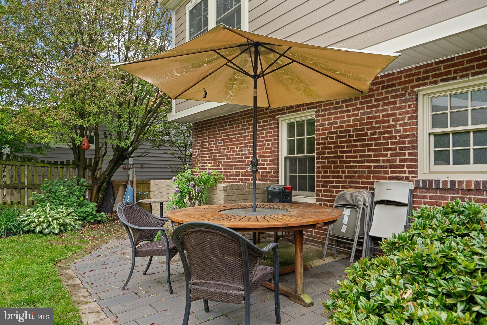 9911 Edgehill Lane Silver Spring, MD 20901 - Photo 34 of 45 a backyard of a house with table and chairs