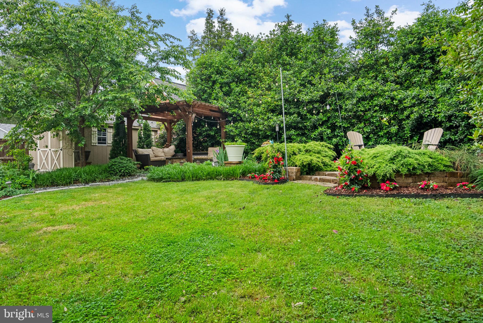 9911 Edgehill Lane Silver Spring, MD 20901 - Photo 35 of 45 a view of a house with a yard and sitting area