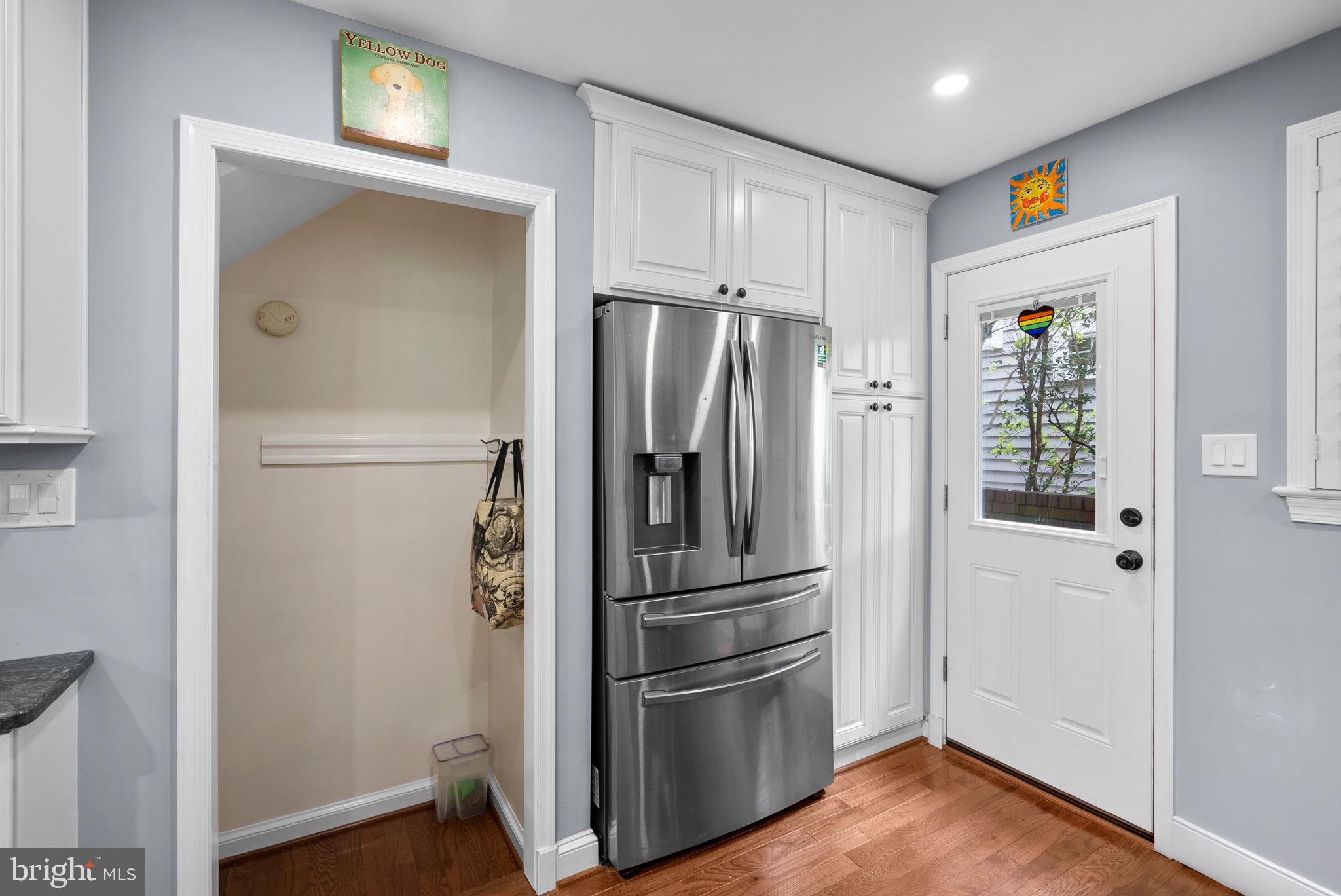 9911 Edgehill Lane Silver Spring, MD 20901 - Photo 39 of 45 a metallic refrigerator freezer sitting in a kitchen