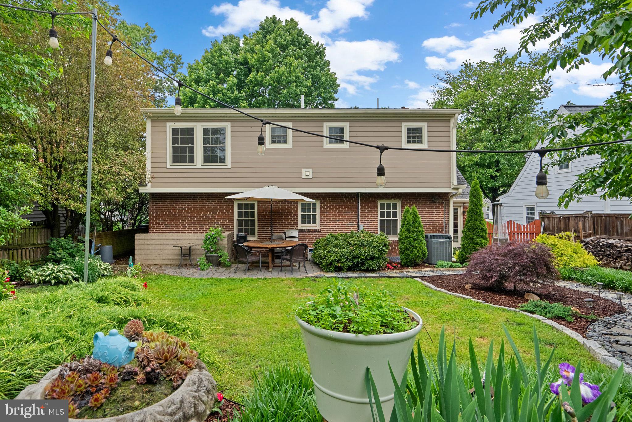 9911 Edgehill Lane Silver Spring, MD 20901 - Photo 40 of 45 a front view of a house with a yard and porch