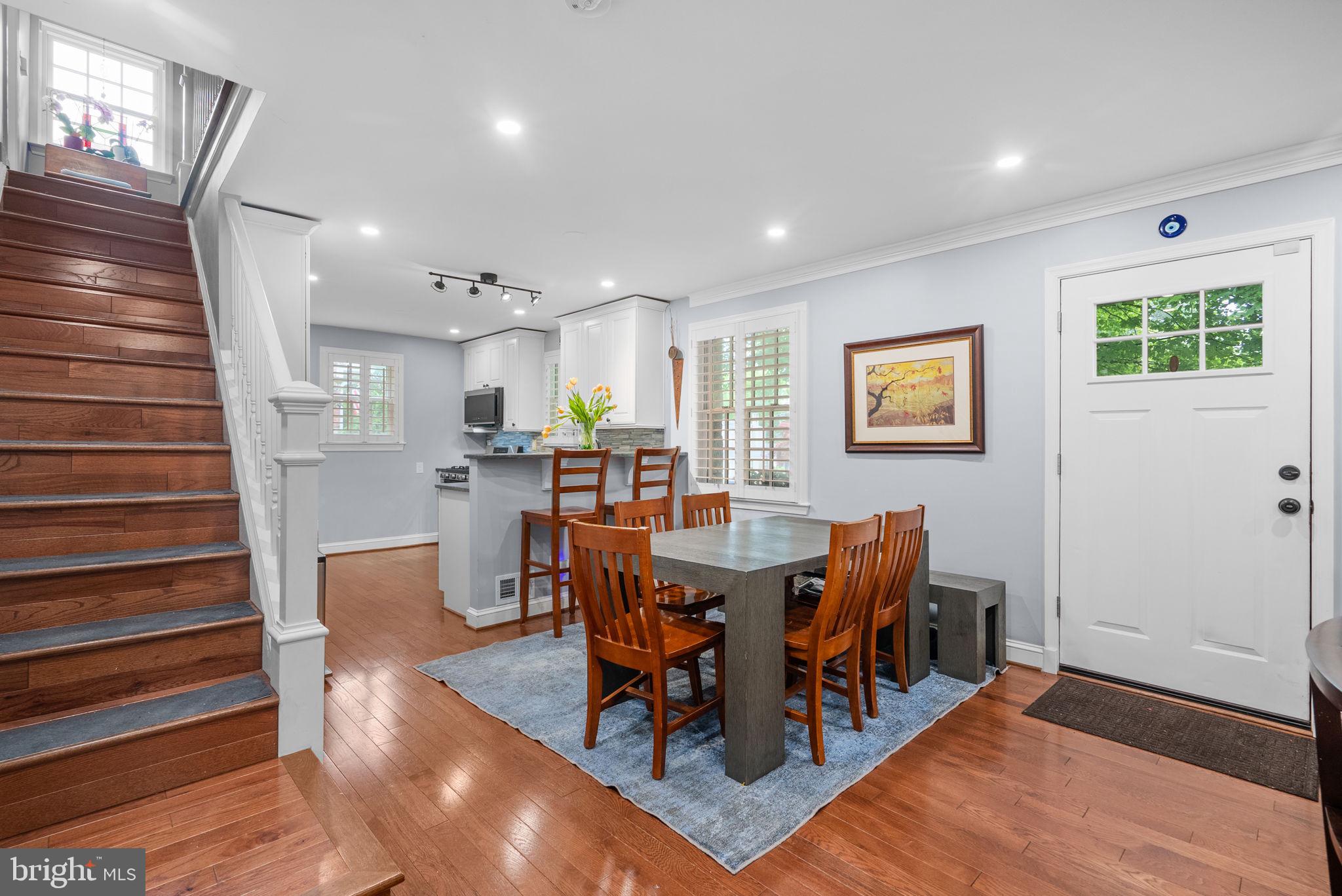 9911 Edgehill Lane Silver Spring, MD 20901 - Photo 4 of 45 a view of a dining room with furniture and wooden floor