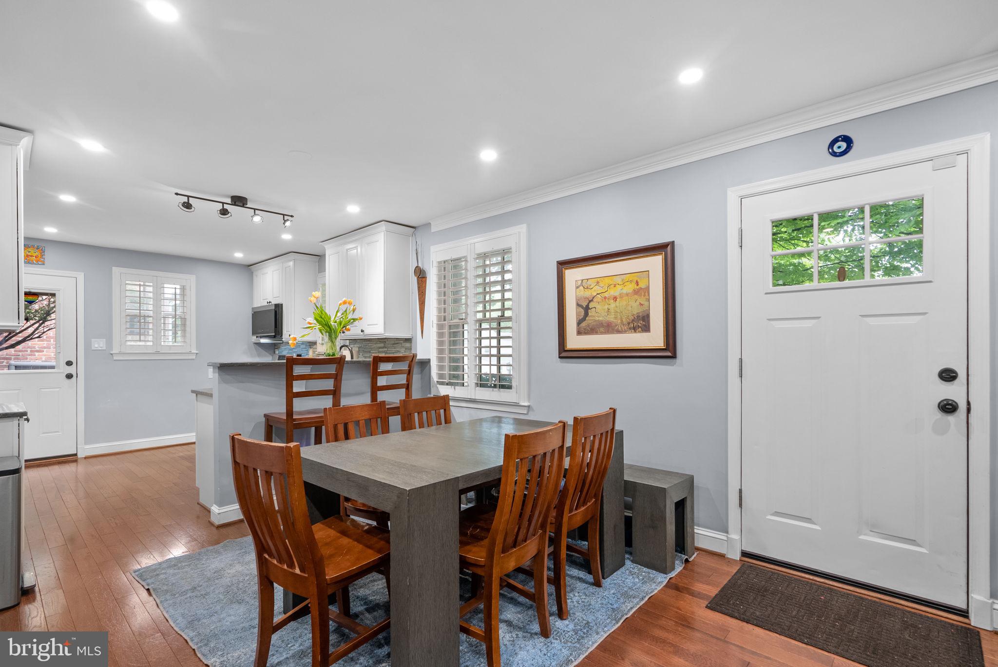 9911 Edgehill Lane Silver Spring, MD 20901 - Photo 5 of 45 a view of a dining room with furniture and wooden floor