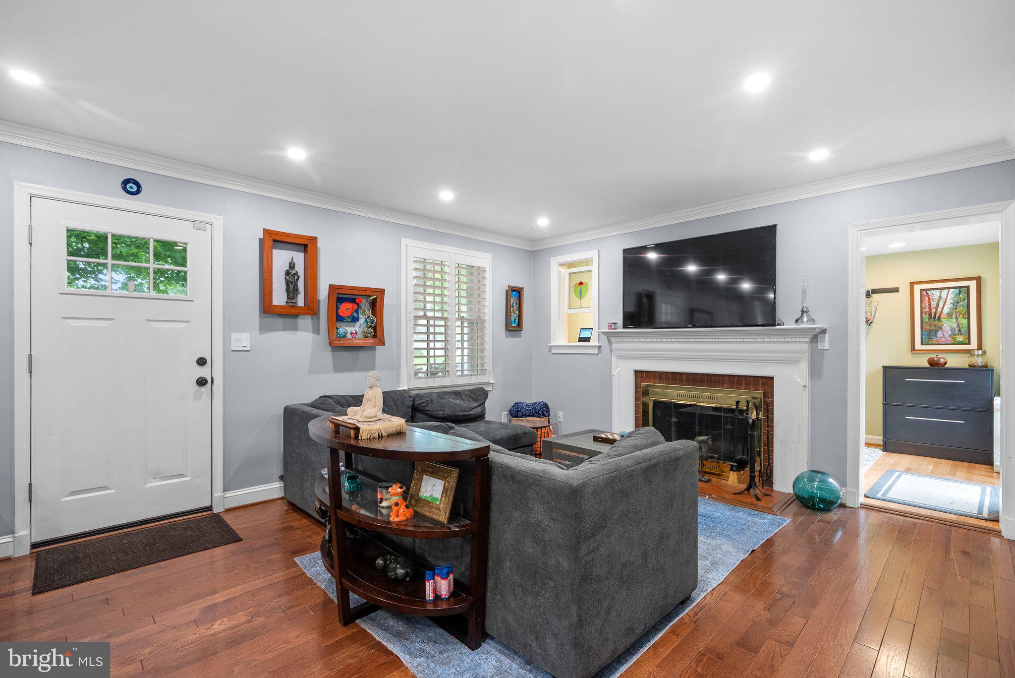 9911 Edgehill Lane Silver Spring, MD 20901 - Photo 6 of 45 a living room with furniture and a fireplace