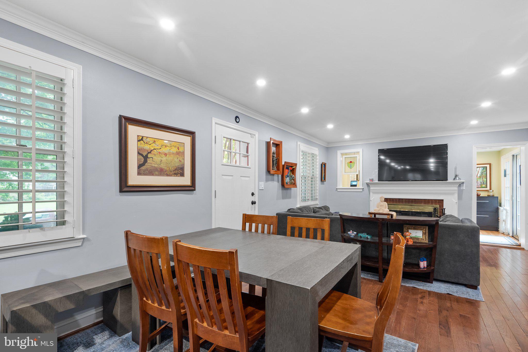 9911 Edgehill Lane Silver Spring, MD 20901 - Photo 8 of 45 a view of a dining room with furniture and wooden floor