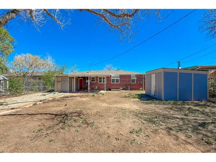 a view of a back yard of a building