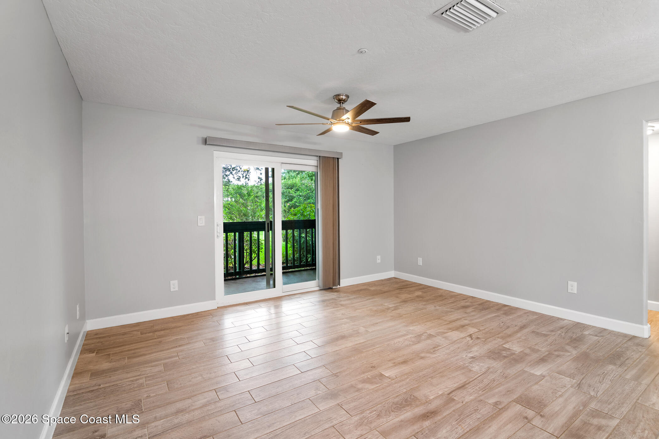 7667 North Wickham Road, Unit 1201 Melbourne, FL 32940 - Photo 19 of 29 Living Room/ Patio