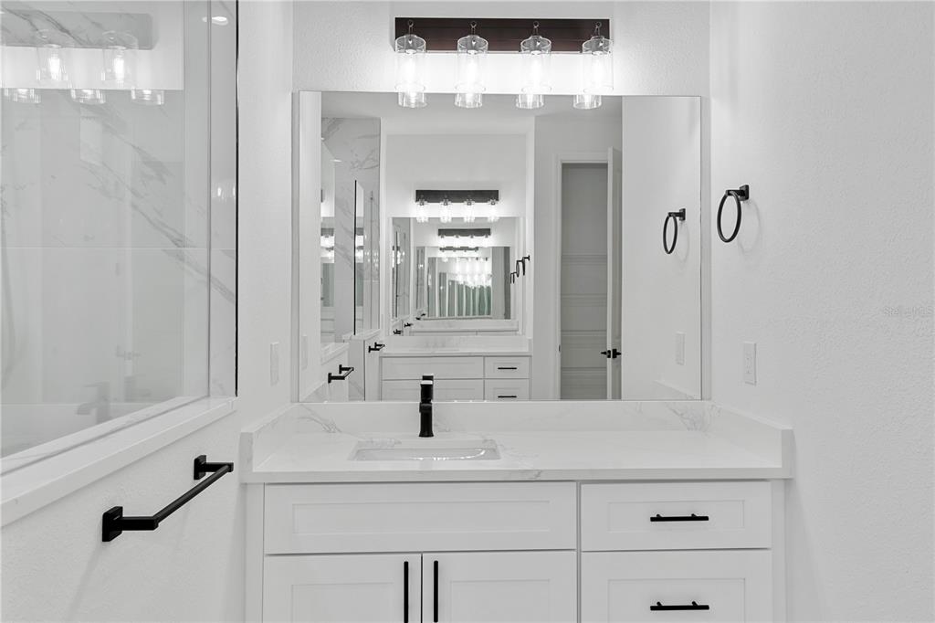 2805 Anniston Road North Port, FL 34288 - Photo 16 of 24 a bathroom with a sink and a mirror