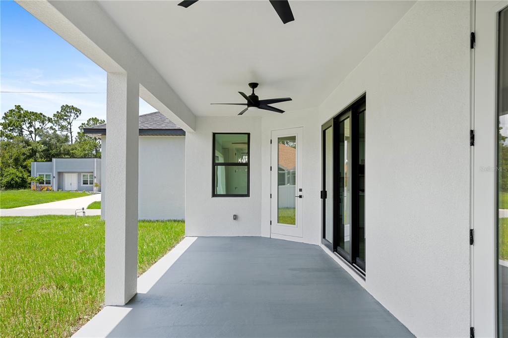 2805 Anniston Road North Port, FL 34288 - Photo 23 of 24 a view of a big room with windows and ceiling fan
