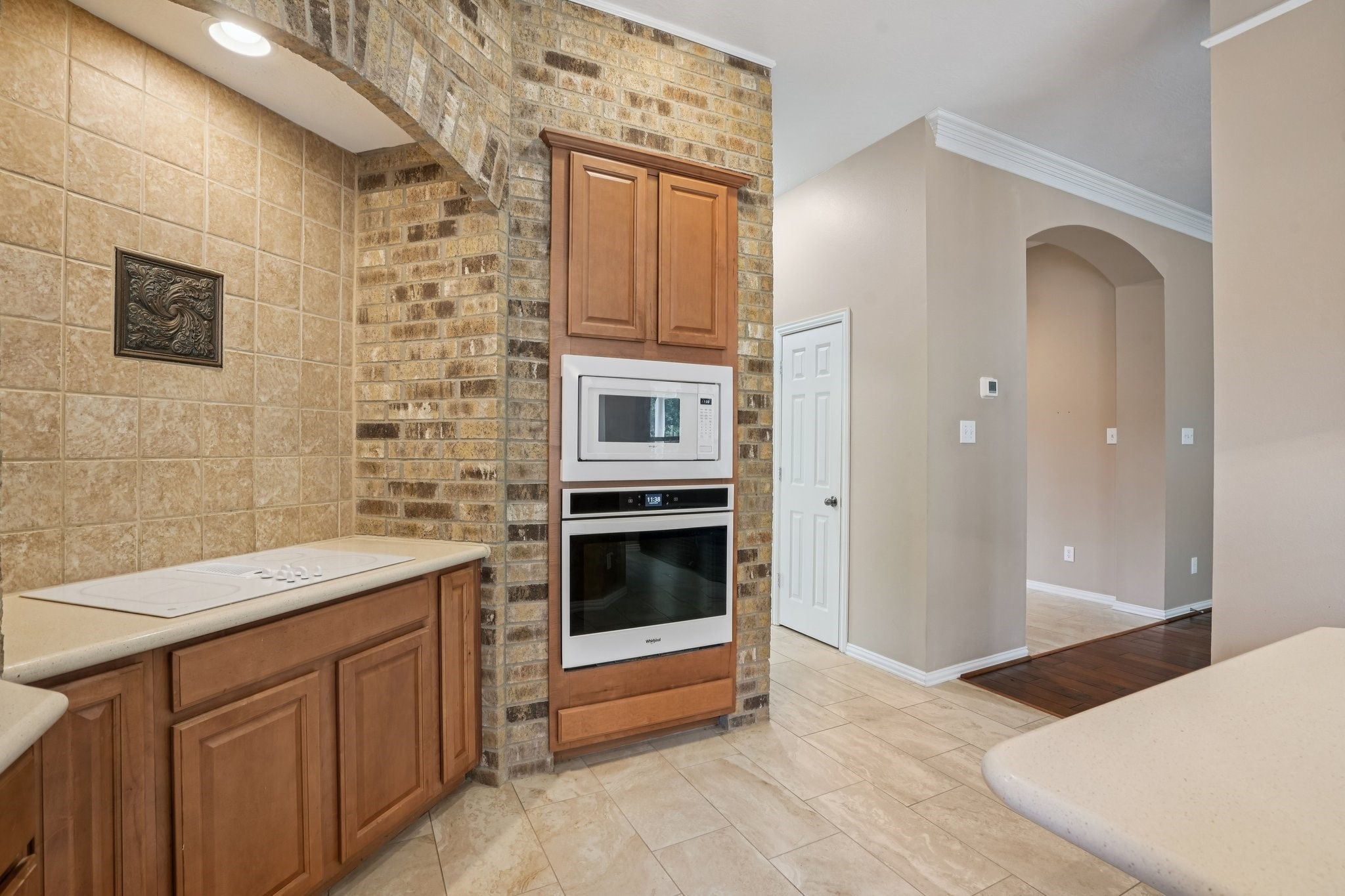 31810 Tree Farm Lane Fulshear, TX 77441 - Photo 14 of 49 Kitchen with brick cooktop