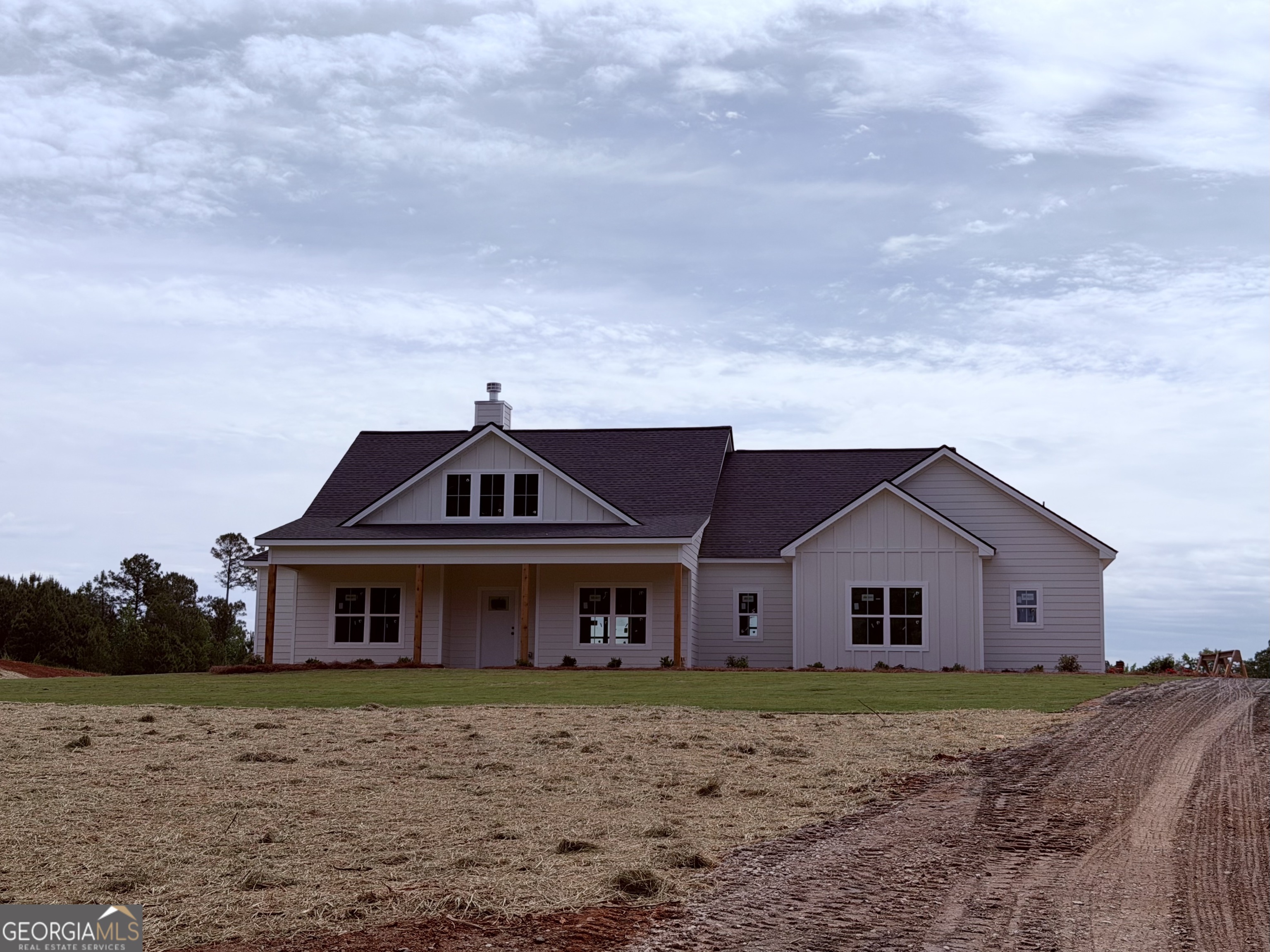 733 Pine Grove Culloden, GA 31016 - Photo 1 of 25 a front view of a house with garden