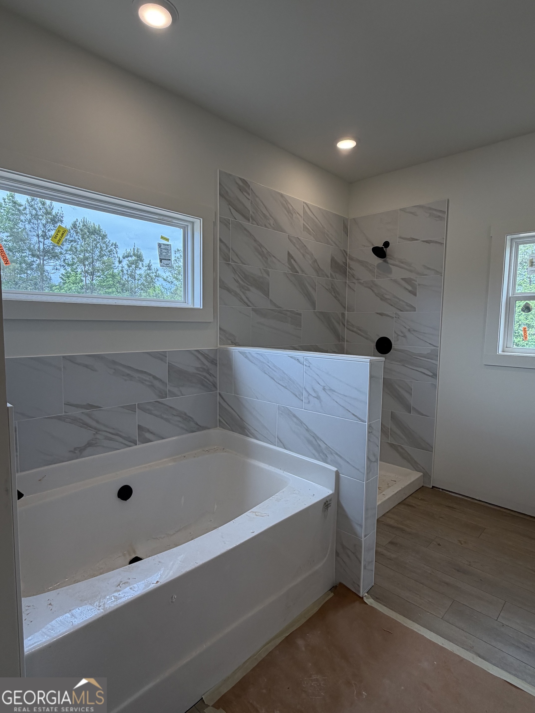 733 Pine Grove Culloden, GA 31016 - Photo 14 of 25 a bathroom with a tub and shower