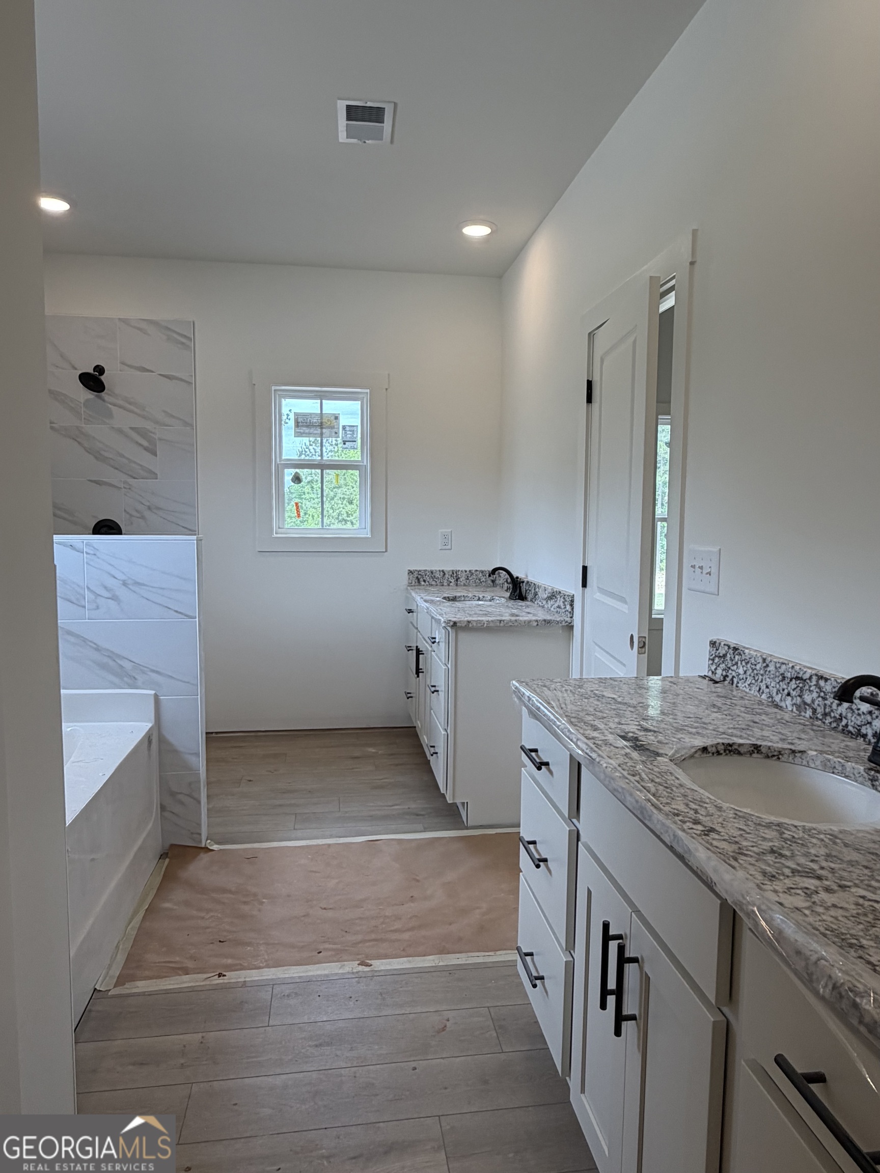 733 Pine Grove Culloden, GA 31016 - Photo 18 of 25 a bathroom with a granite countertop sink a toilet and mirror