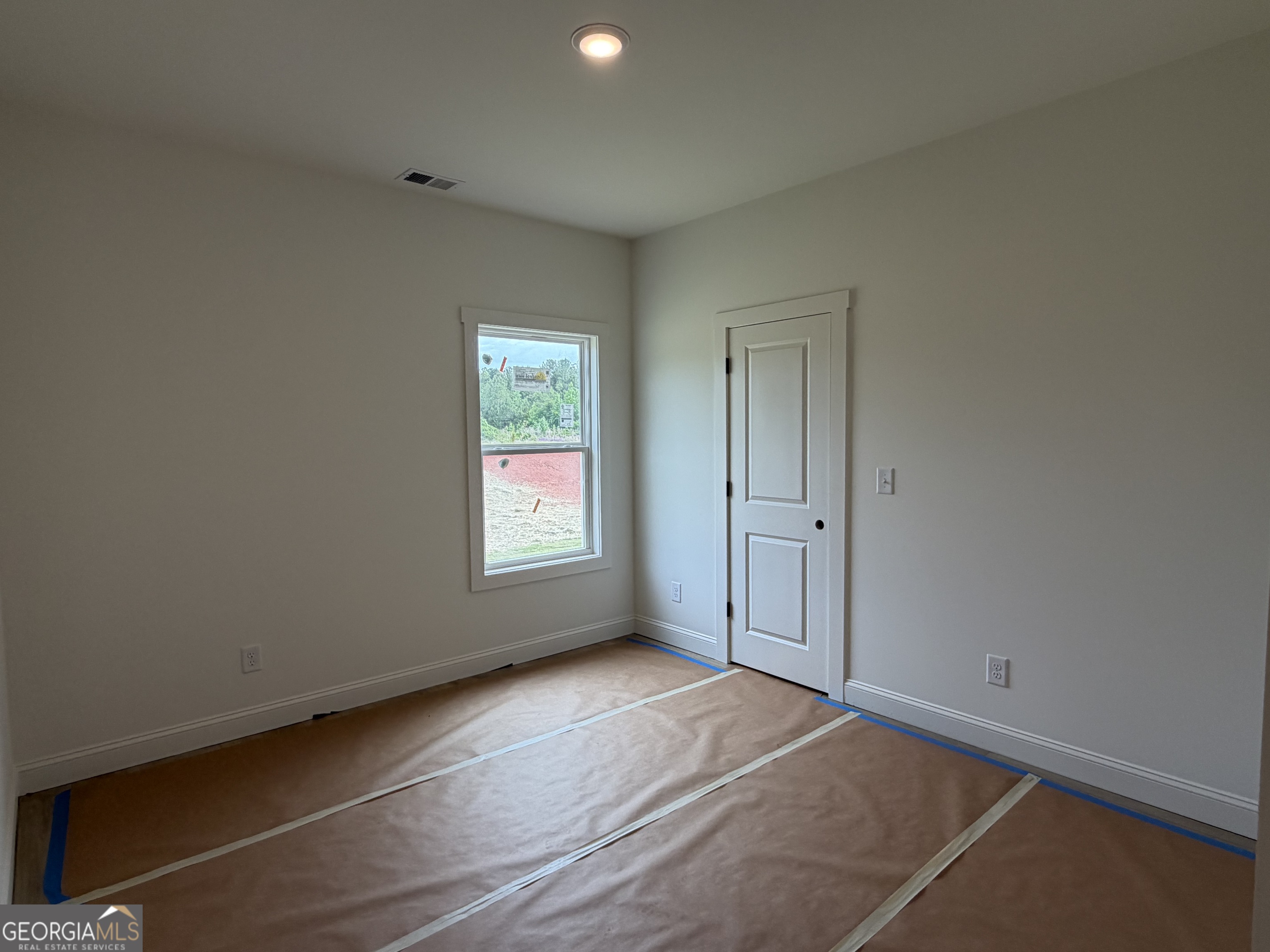 733 Pine Grove Culloden, GA 31016 - Photo 21 of 25 an empty room with windows and closet