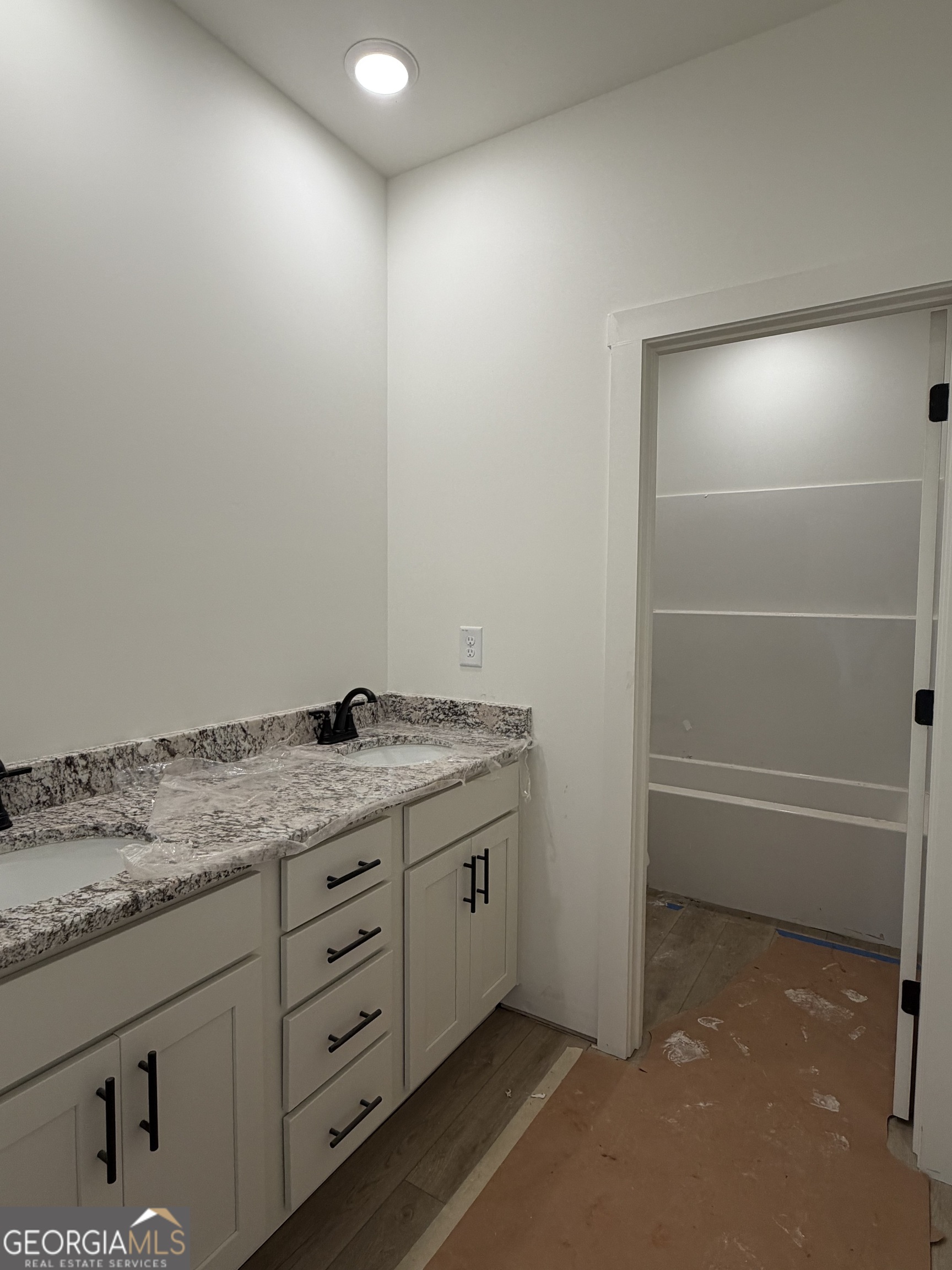 733 Pine Grove Culloden, GA 31016 - Photo 22 of 25 a bathroom with a granite countertop sink and a mirror