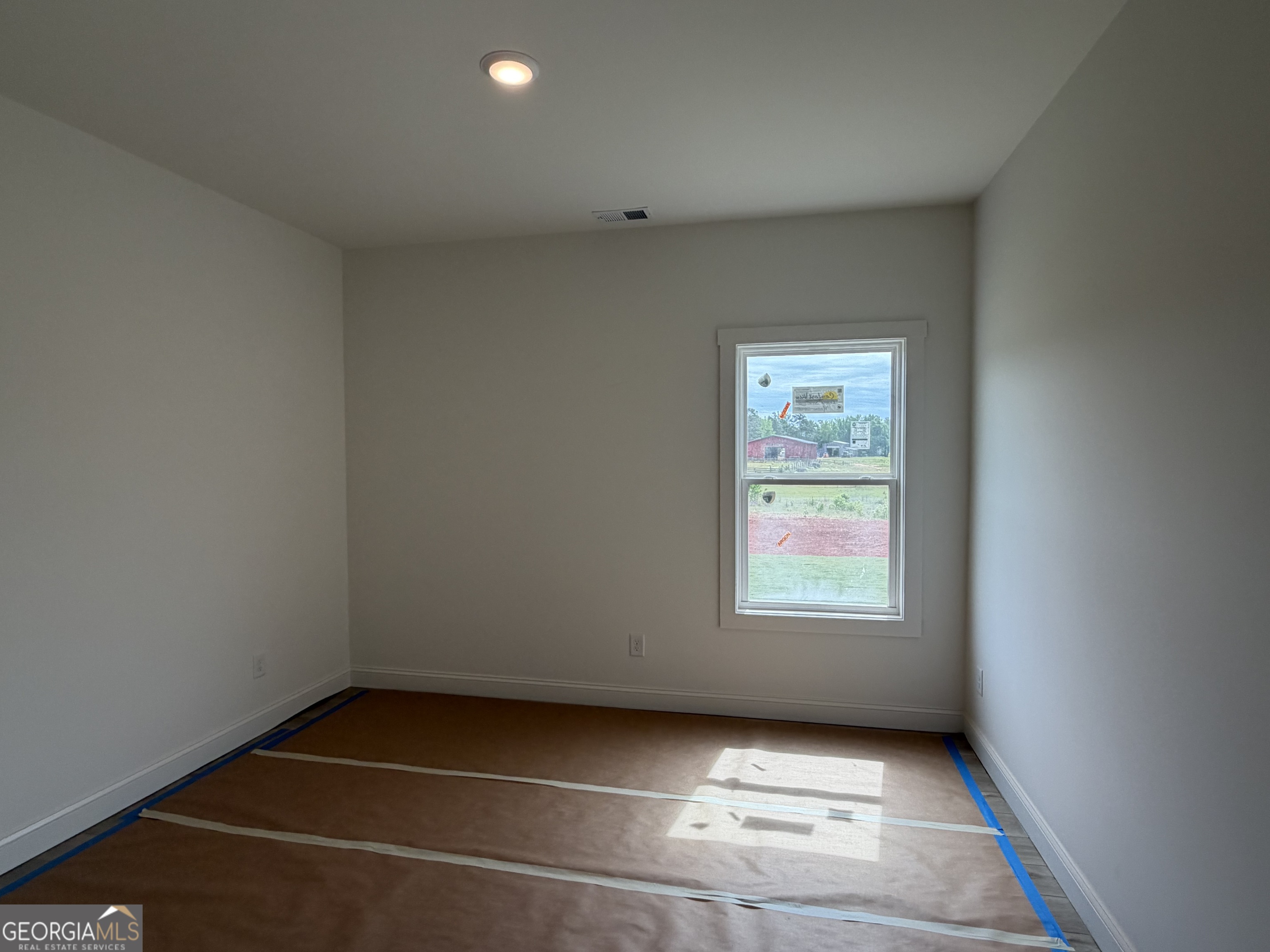 733 Pine Grove Culloden, GA 31016 - Photo 23 of 25 an empty room with windows