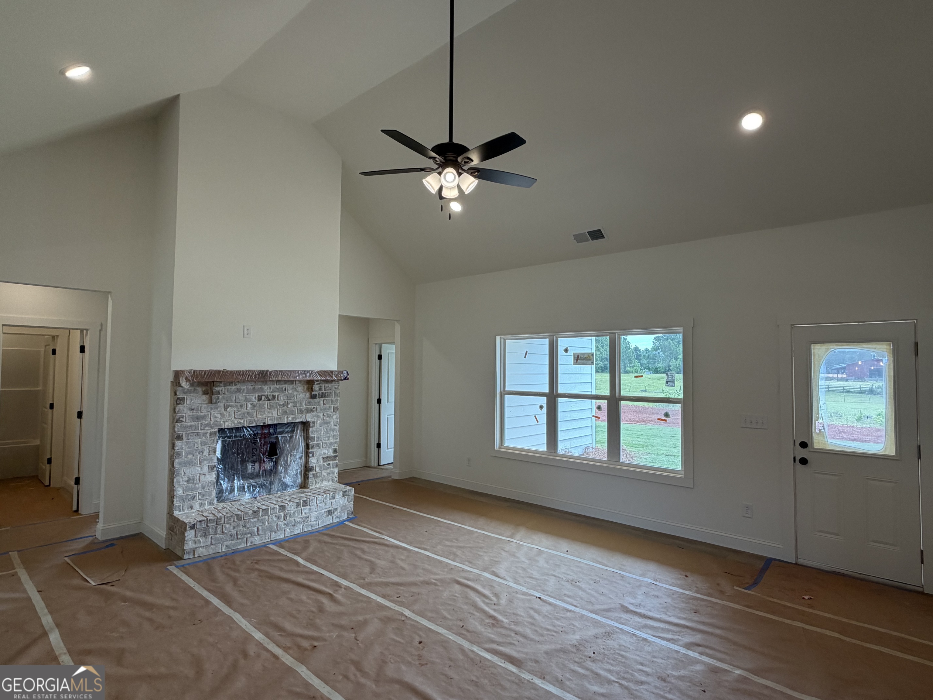 733 Pine Grove Culloden, GA 31016 - Photo 3 of 25 a view of an empty room with window and fireplace