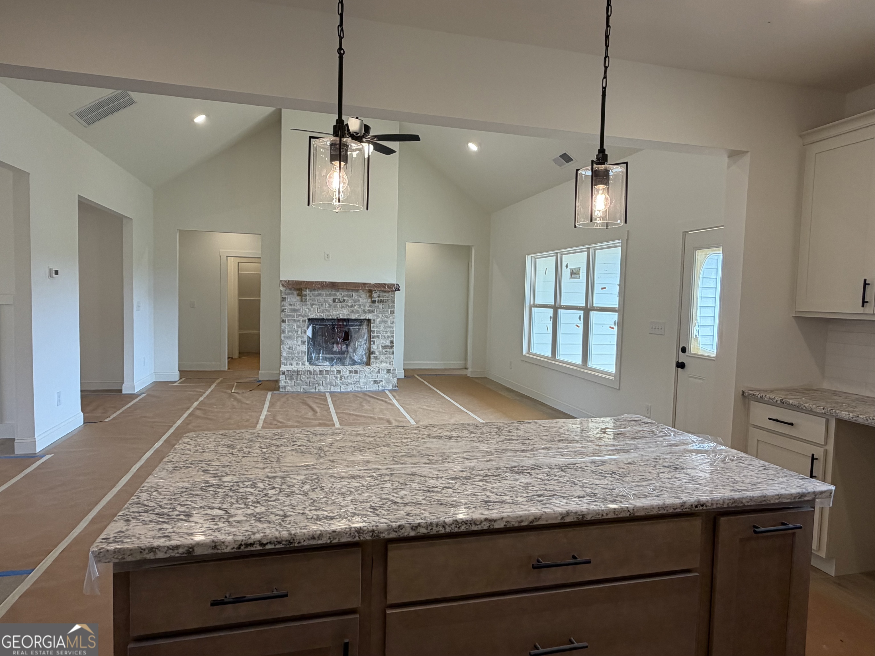 733 Pine Grove Culloden, GA 31016 - Photo 5 of 25 a kitchen with kitchen island granite countertop a stove and a center island