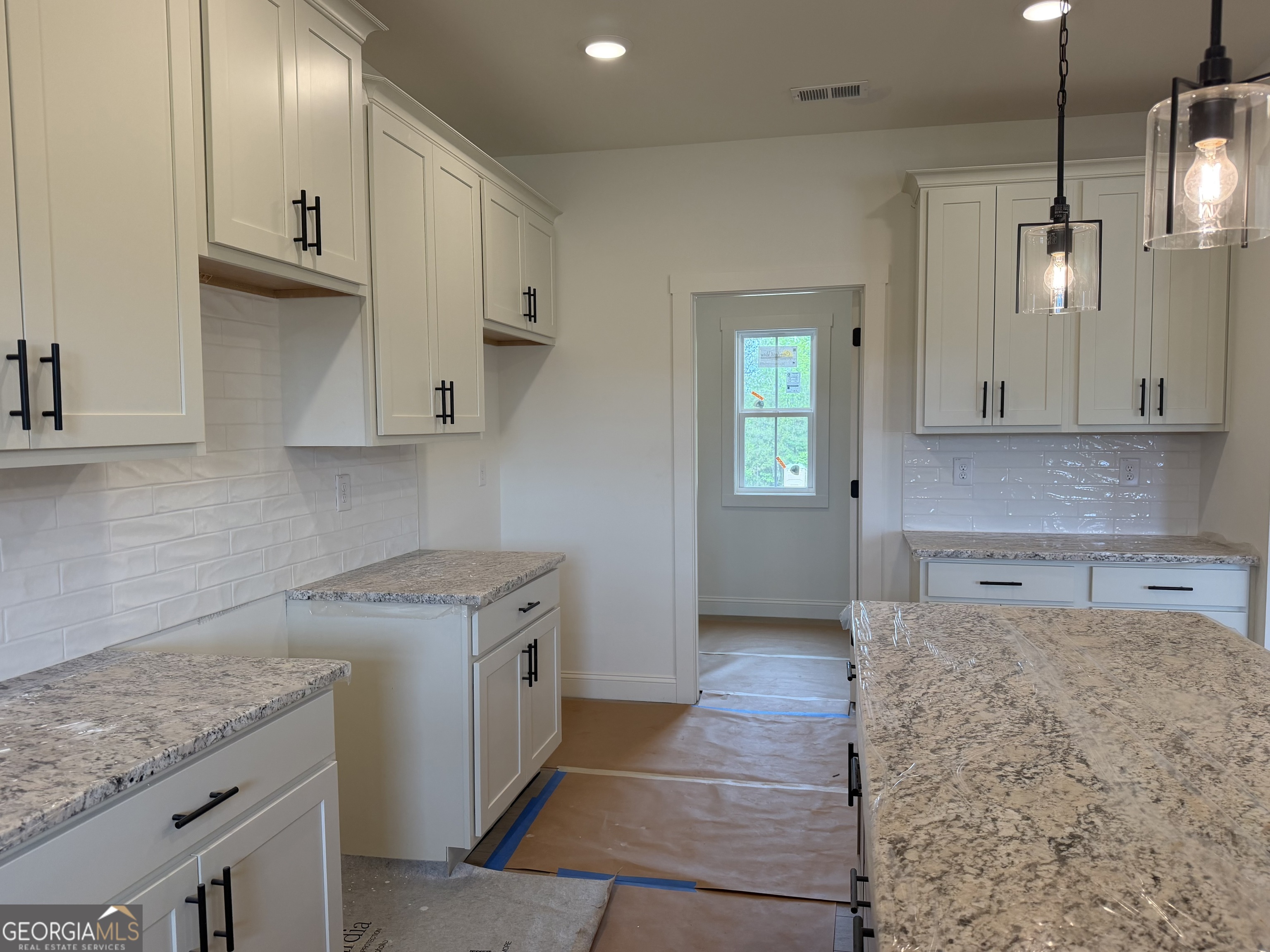 733 Pine Grove Culloden, GA 31016 - Photo 6 of 25 a kitchen with stainless steel appliances granite countertop a sink stove and cabinets
