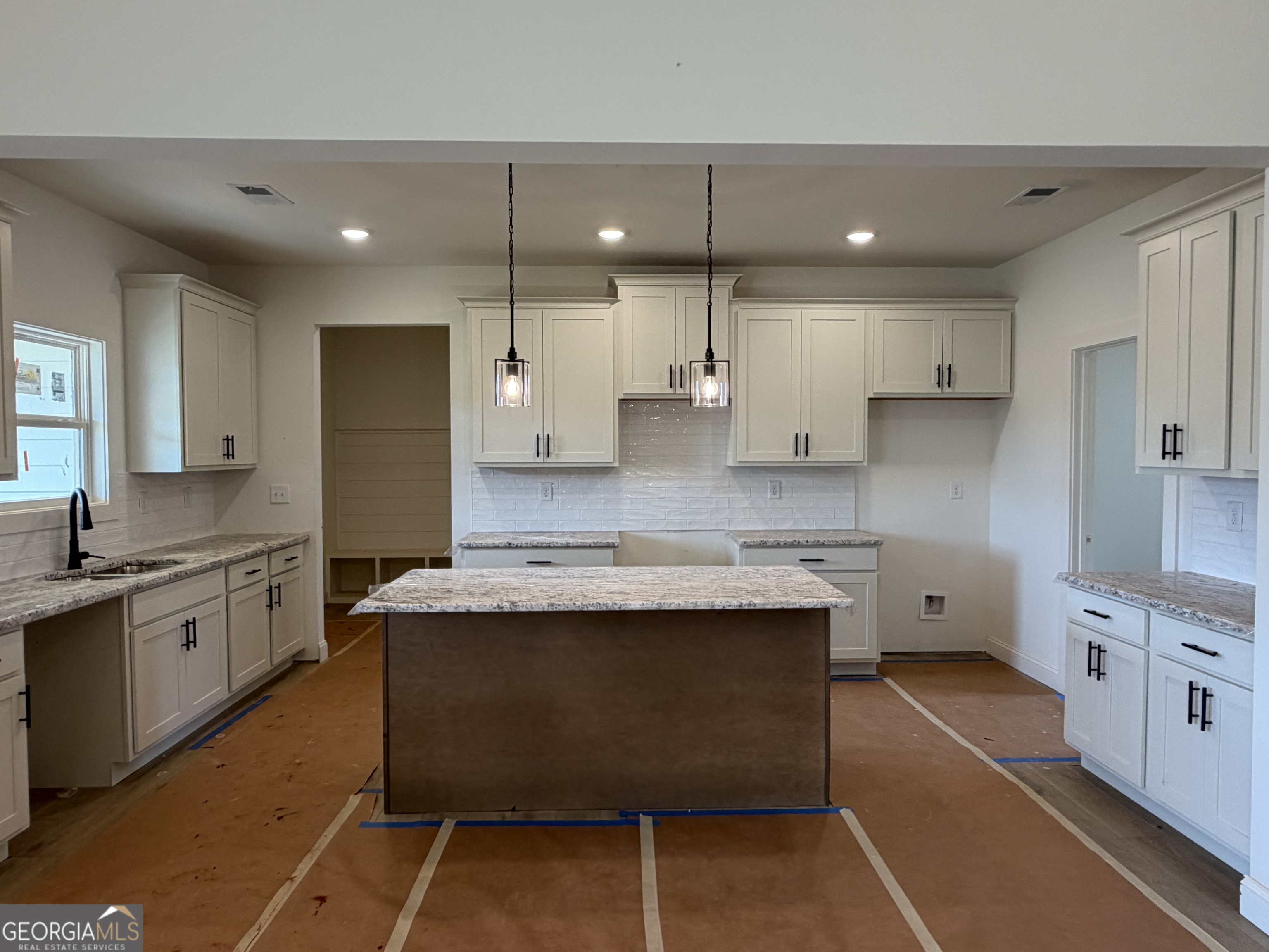 733 Pine Grove Culloden, GA 31016 - Photo 7 of 25 a view of a kitchen with kitchen island a sink stainless steel appliances and cabinets