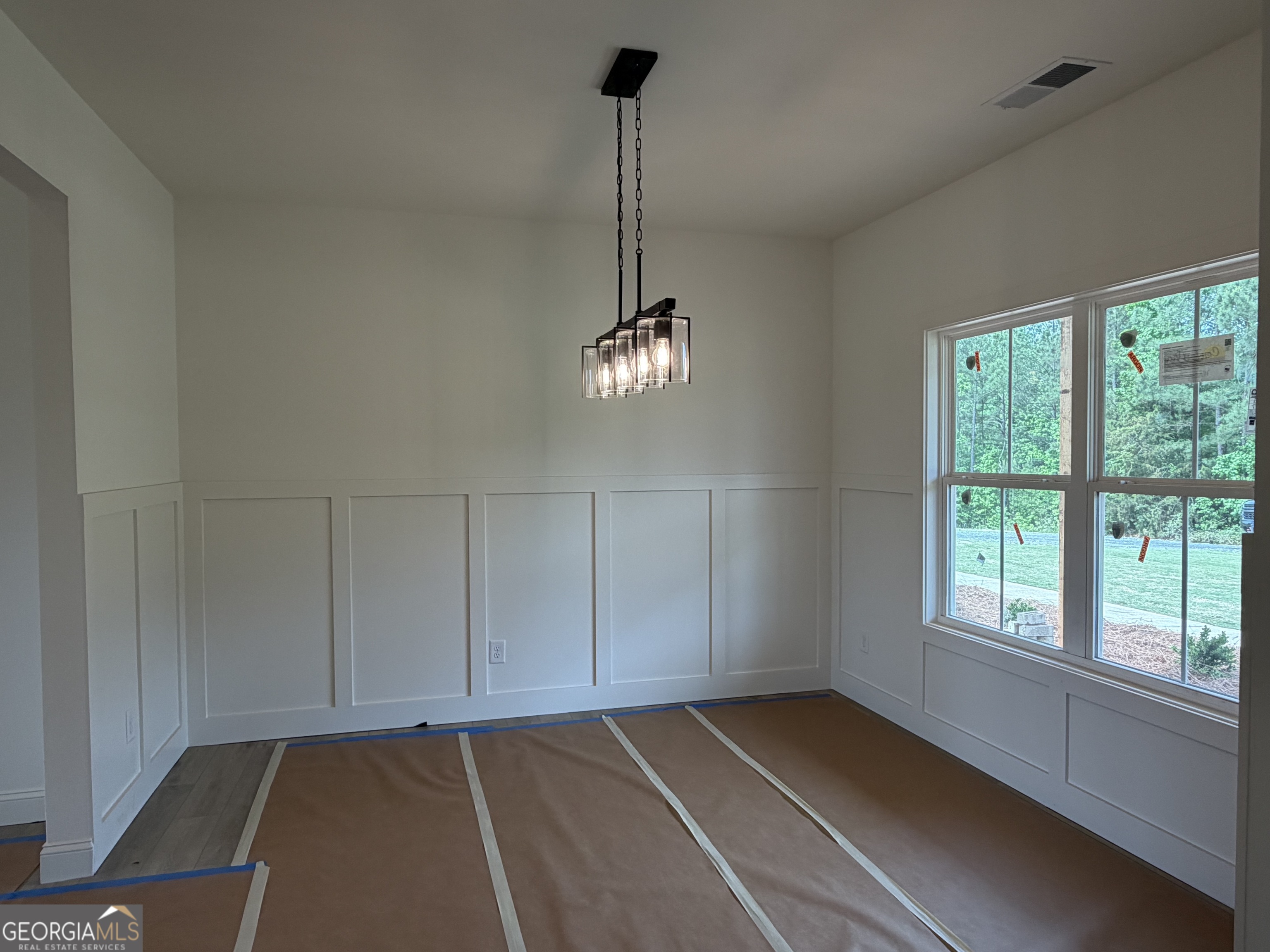 733 Pine Grove Culloden, GA 31016 - Photo 10 of 25 a view of an empty room with chandelier fan and a window
