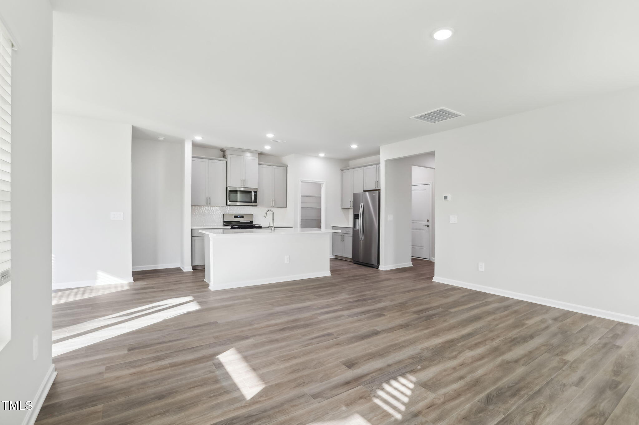 185 White Birch Lane Angier, NC 27501 - Photo 10 of 27 a view of a kitchen with a sink and a refrigerator